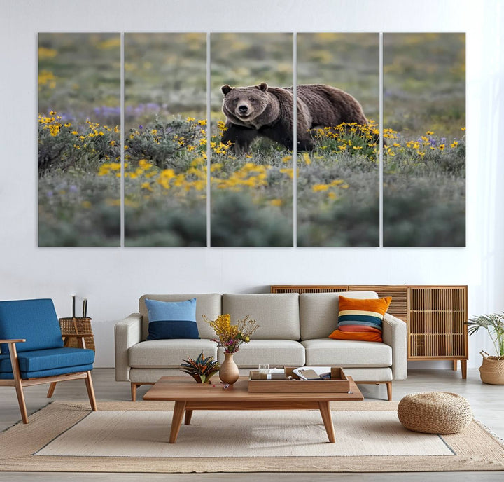 The "Grizzly 399 in Wild Flowers Wall Art Canvas Print" features a grizzly bear strolling through a field of yellow and purple flowers, beautifully showcased as a triptych. This handcrafted piece, proudly made in the USA, adds charm and sophistication to your space.