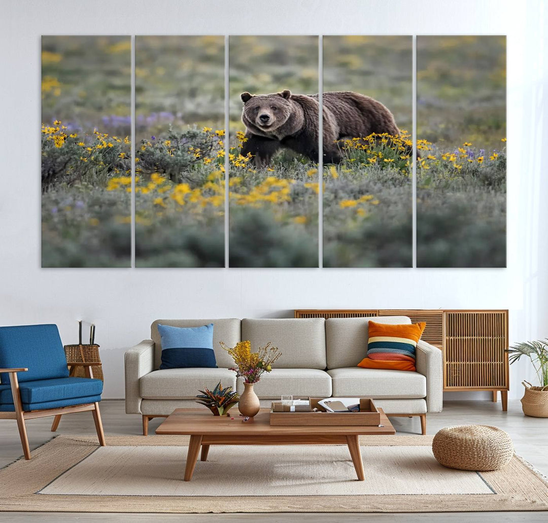 The "Queen of the Tetons" is a stunning canvas wall art print featuring Grizzly 399 walking through a field of yellow and purple flowers, showcasing the gallery-quality finish.