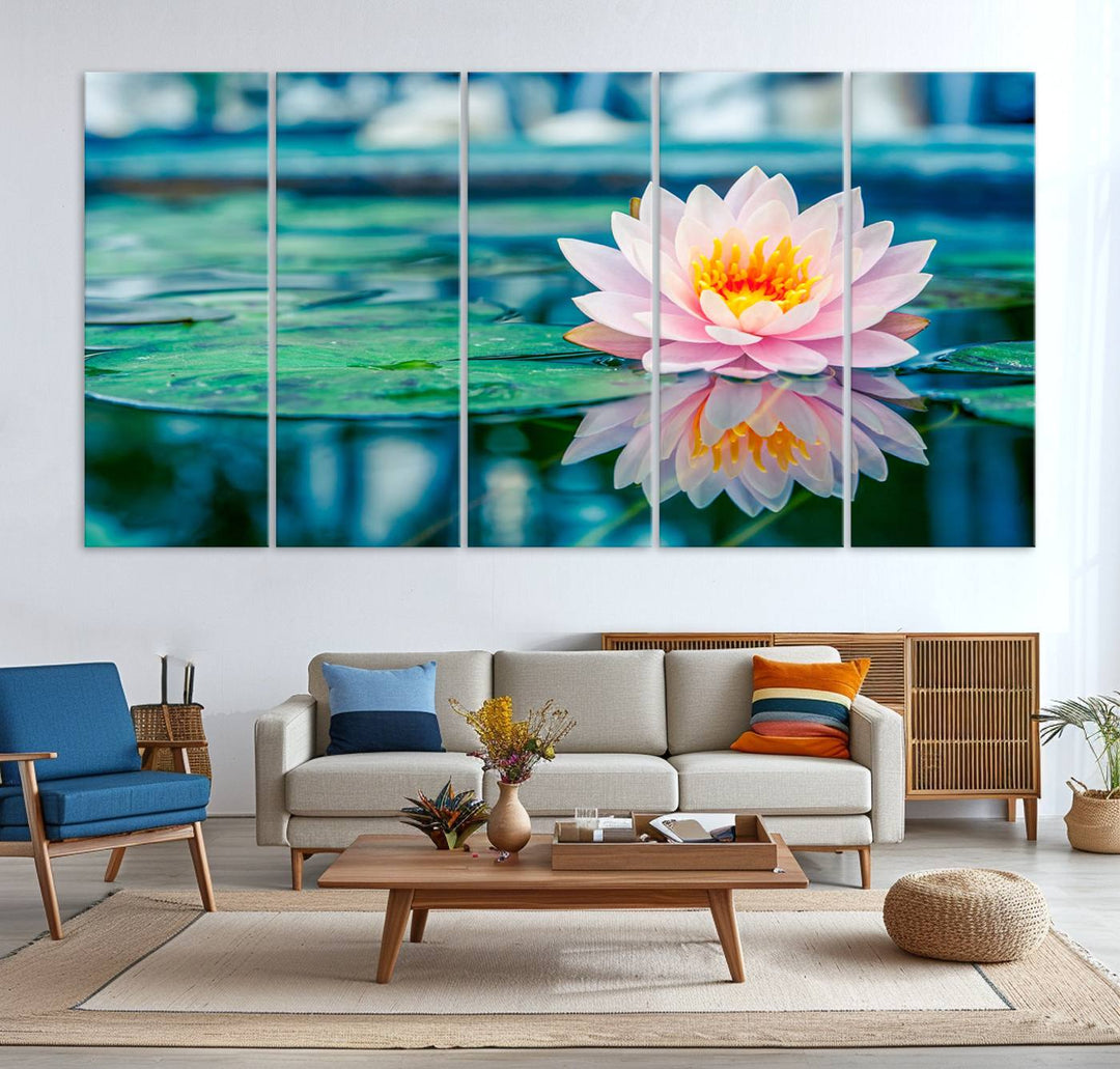 The Lotus Flower Canvas Print showcases a pink water lily with a yellow center gracefully floating on a calm pond.