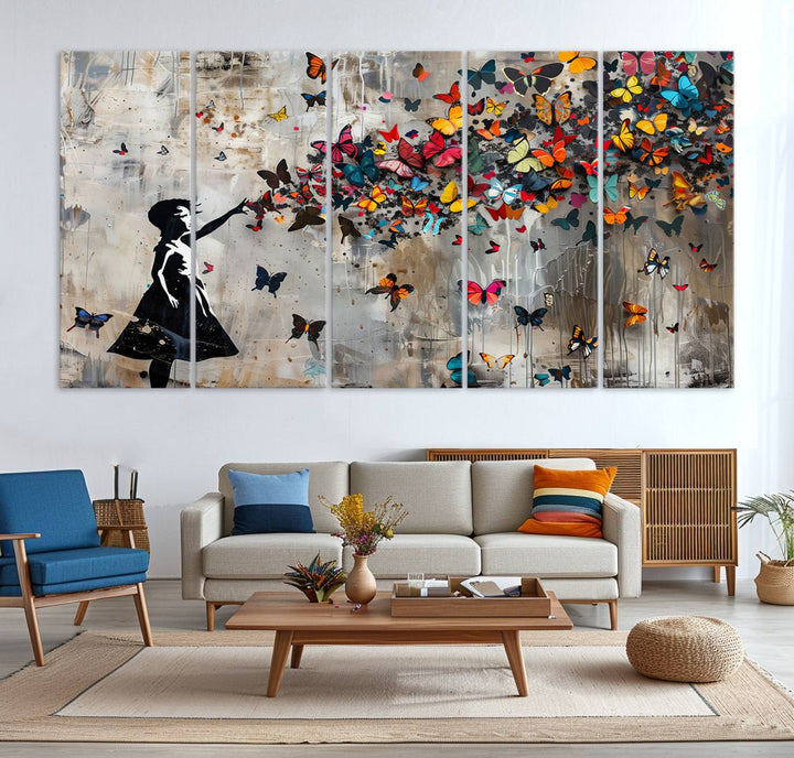 The Banksy Butterfly Girl 3-Piece Modern Graffiti Canvas Wall Art features a silhouette of a girl reaching for butterflies.