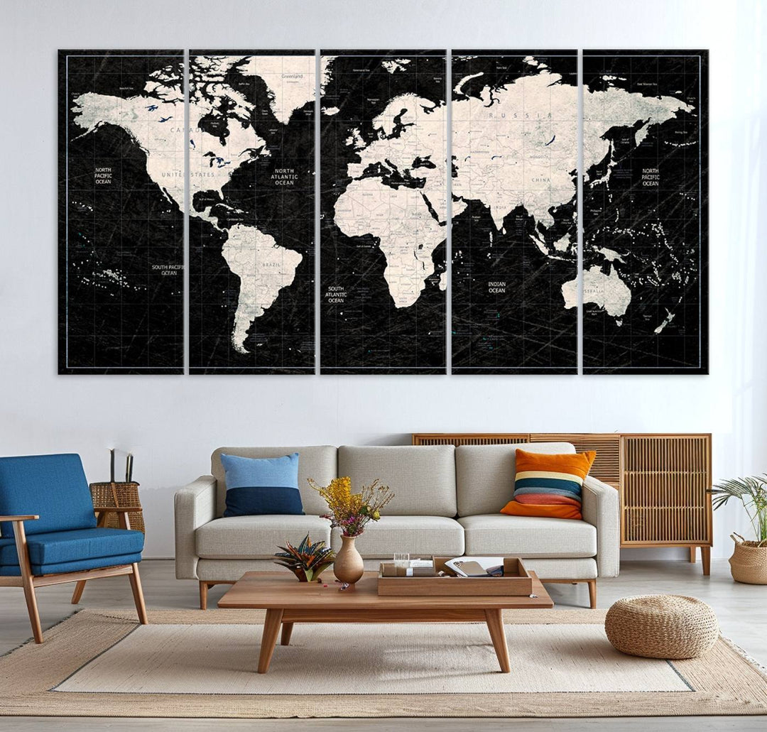 A bold global style framed black and white world map canvas print, presented in three panels, perfect for modern home or office decor.