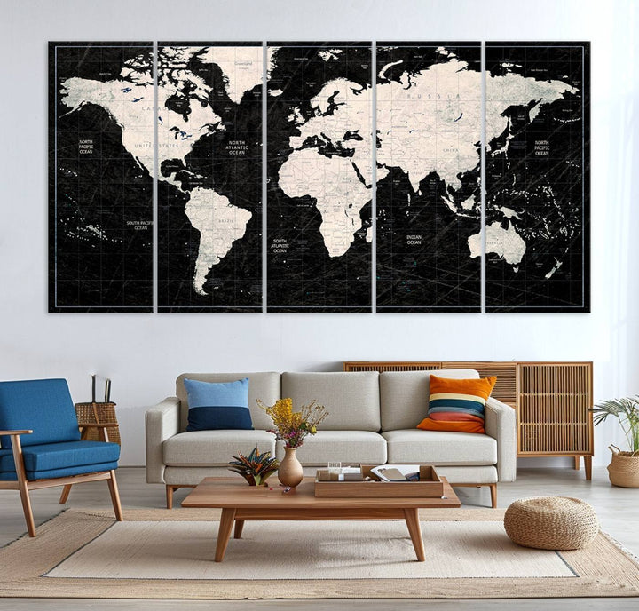 A bold global style framed black and white world map canvas print, presented in three panels, perfect for modern home or office decor.