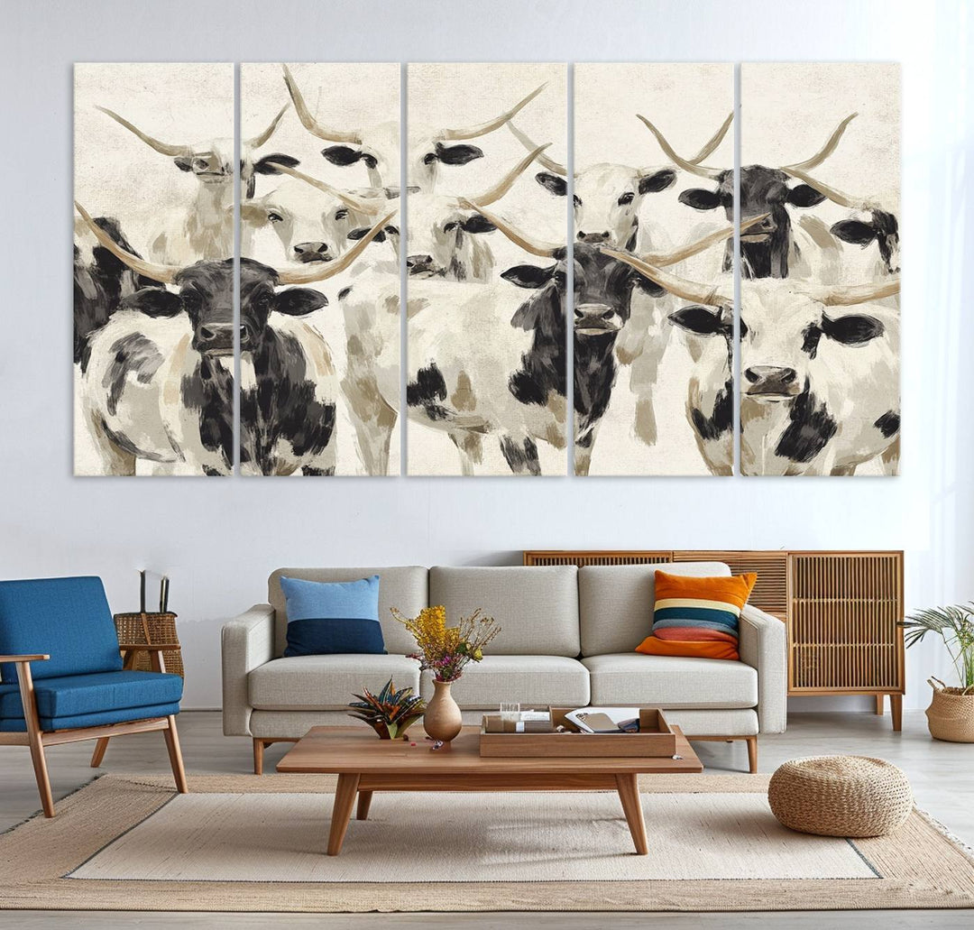 Canvas print titled Longhorn Texas Cow Drawing, depicting longhorn cattle with black and white markings, made in the USA, displayed on the wall.