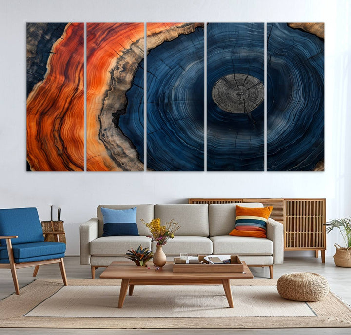 Abstract Tree Ring Wall Art Print on canvas featuring vibrant blue, orange, and brown rings with a natural rustic wood texture. Free shipping available!.