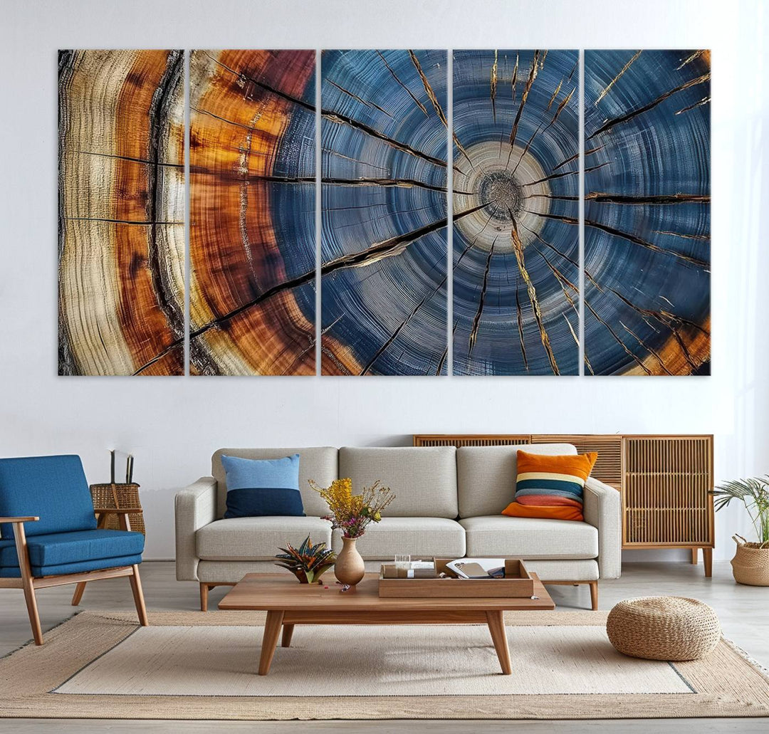 Close-up of blue, brown, and orange wood grain rings on the Abstract Tree Rings Canvas Wall Art Print.