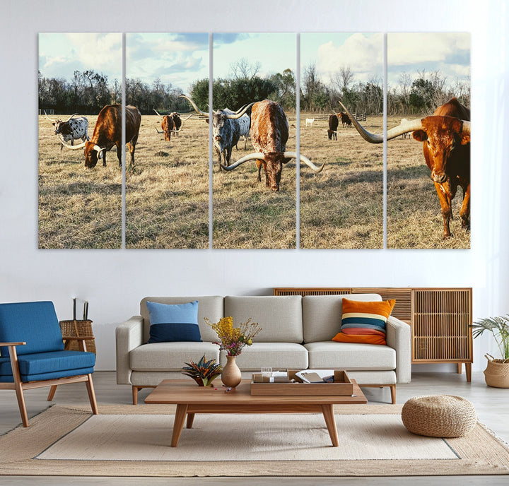 A herd of Texas Longhorn cattle grazing in an open field under a partly cloudy sky, capturing a rustic and Western ranch aesthetic.