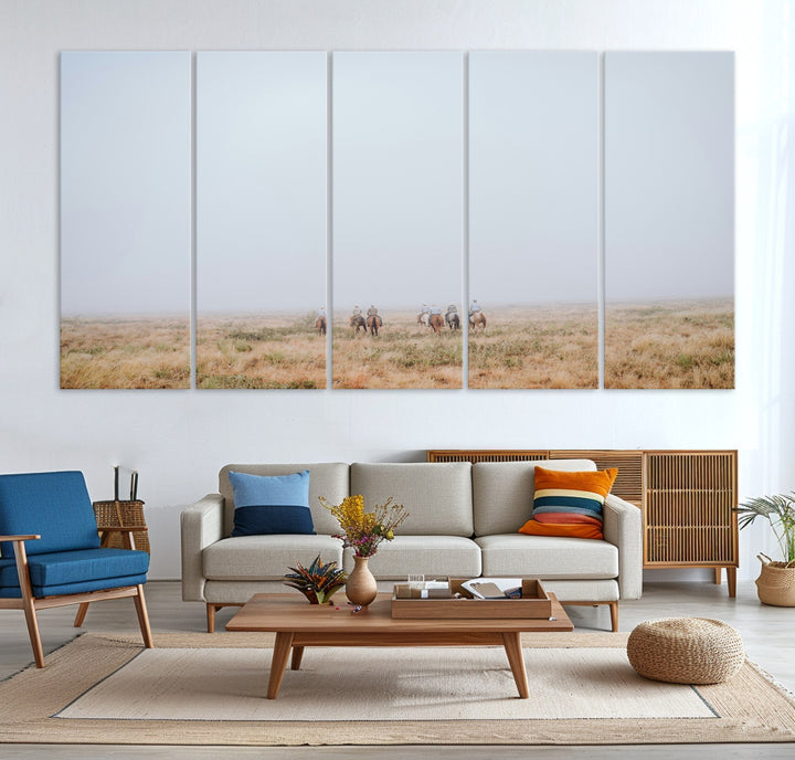A group of horseback riders moving through a fog-shrouded field, evoking a calm Western scene with golden grasses and soft horizons.
