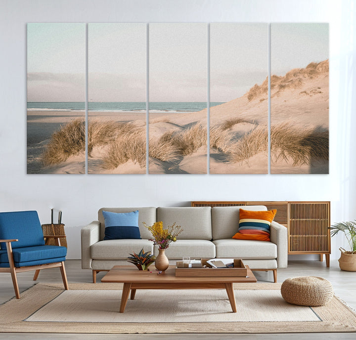 Soft pastel-toned beach scene with sand dunes, windswept grasses, and a calm ocean horizon, creating a serene coastal atmosphere.