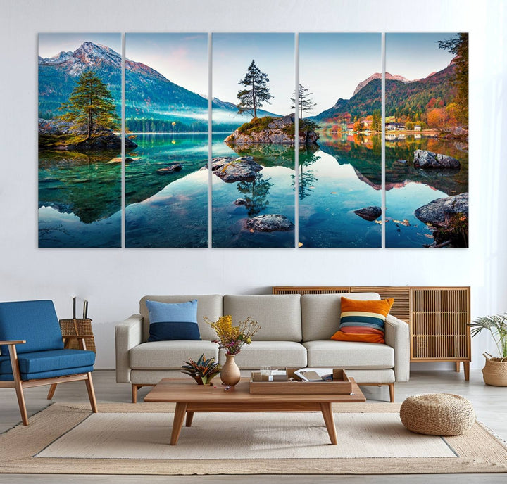 The 3-panel wall art showcases a serene mountain lake with rocky islands and trees, creating an ideal focal point for dining rooms or offices.