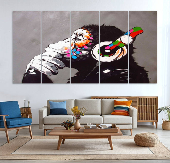 A vibrant triptych, the "DJ Monkey Listening to Music" wall art print, features a Banksy-inspired large canvas adorned with colorful modern pop art. This striking piece elegantly enhances the room with its dynamic and lively depiction.