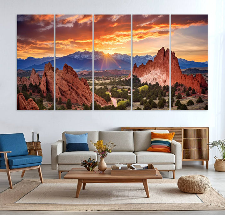 A vibrant sunset over the Rocky Mountains with red rocks.