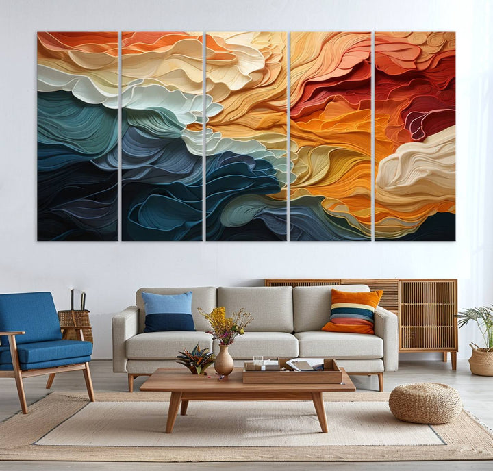 A Blue Orange Abstract Wave Wall Art Canvas Print adorns the wall. This colorful masterpiece is professionally hand-assembled to enhance any space.