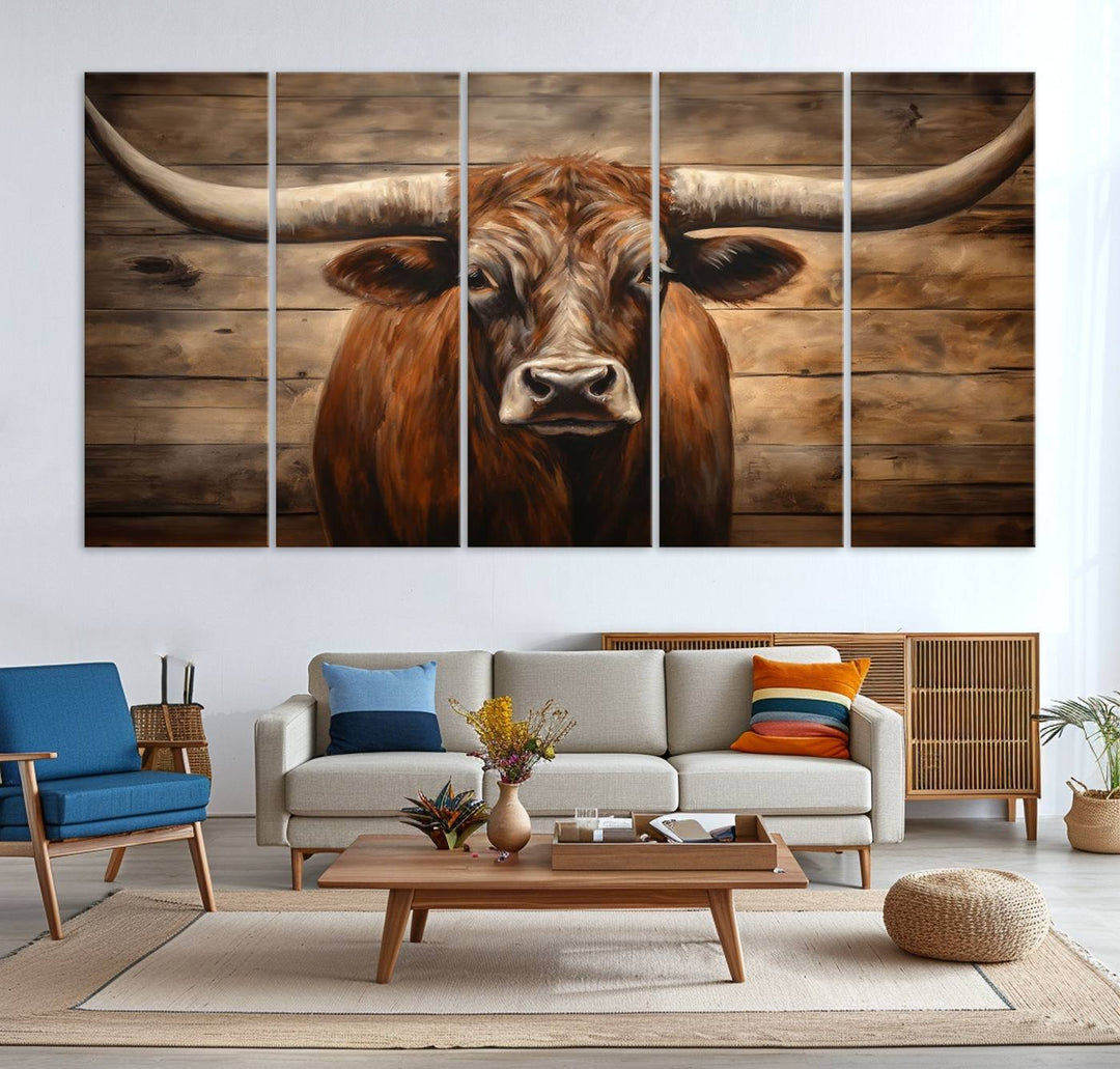 The Longhorn Bull Wall Art, a ready-to-hang canvas print, showcases an image of a brown longhorn cow set against a wooden background, perfect for those looking to enhance their space with rustic farmhouse and western barn decor.