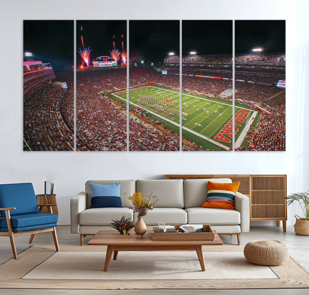 The University of Nebraska Cornhuskers Football Team Print, featuring Lincoln Memorial Stadium in a vibrant triptych canvas with fireworks above and a gallery-quality finish, is elegantly displayed.