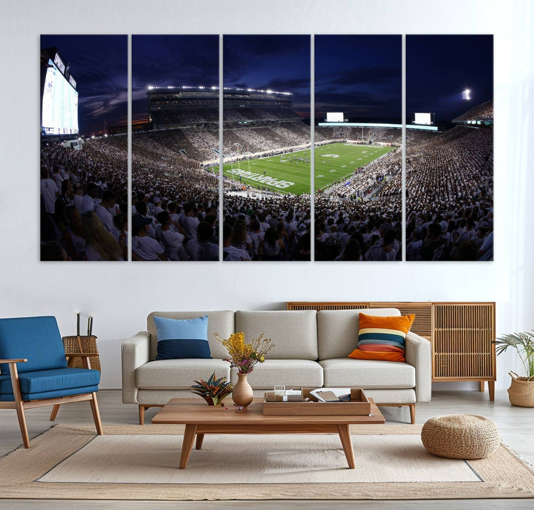 A packed football stadium at night, with bright lights and fans in white, depicted in a Michigan State Spartans Stadium wall art.