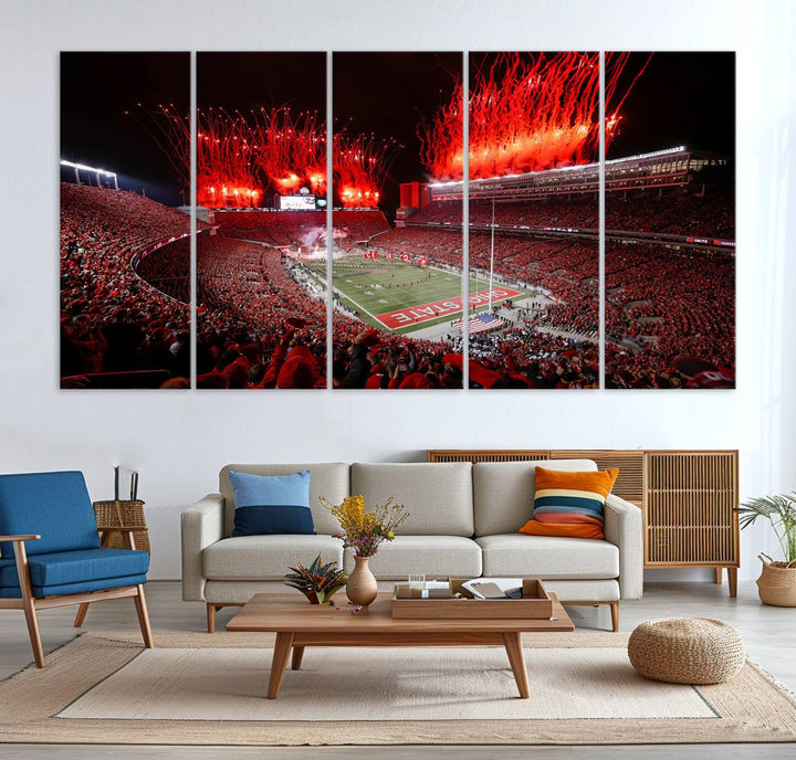 A vibrant red canvas art of a packed Ohio State Buckeyes stadium at night with fireworks.