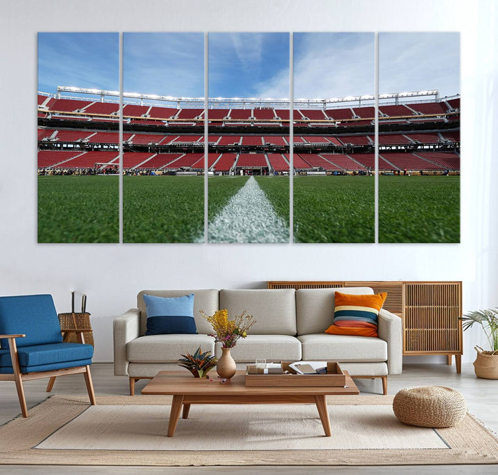 A canvas print of the University of Tulsa Golden Hurricane showcases H.A. Chapman Stadiums football field and red seats against a backdrop of a blue sky.