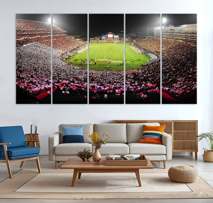 The Maryland Terrapins Football Wall Art Canvas showcases a packed SECU Stadium at night with a bright field and cheering fans.