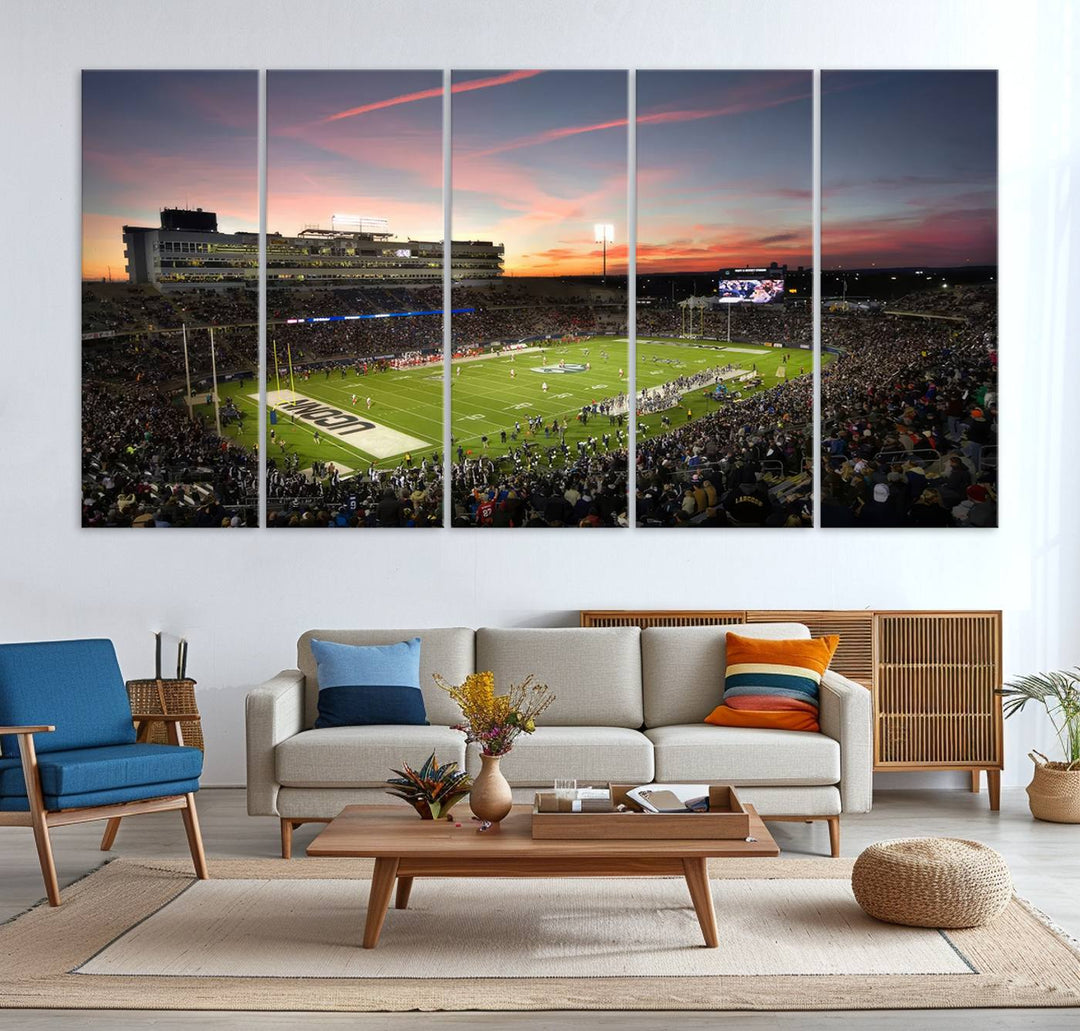 This wall art canvas print captures UCONN Huskies fans energizing a sunset scene at East Hartfords Pratt & Whitney Stadium.