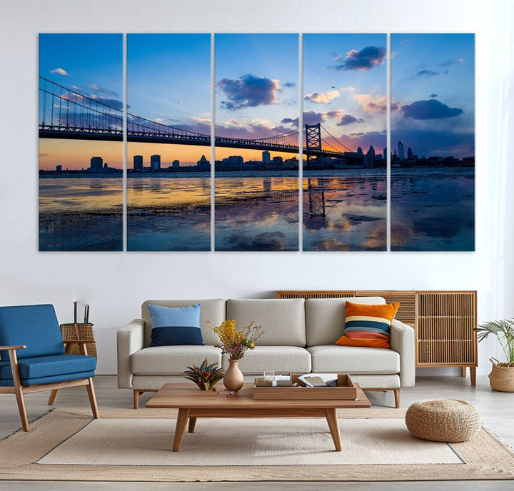 A photograph titled "Large Wall Art Philadelphia Canvas Print - Benjamin Franklin Bridge at Sunset" displays a breathtaking cityscape of the bridge reflected in the water. This image features a gallery-quality finish that promises to transform any space into an evocative memory.