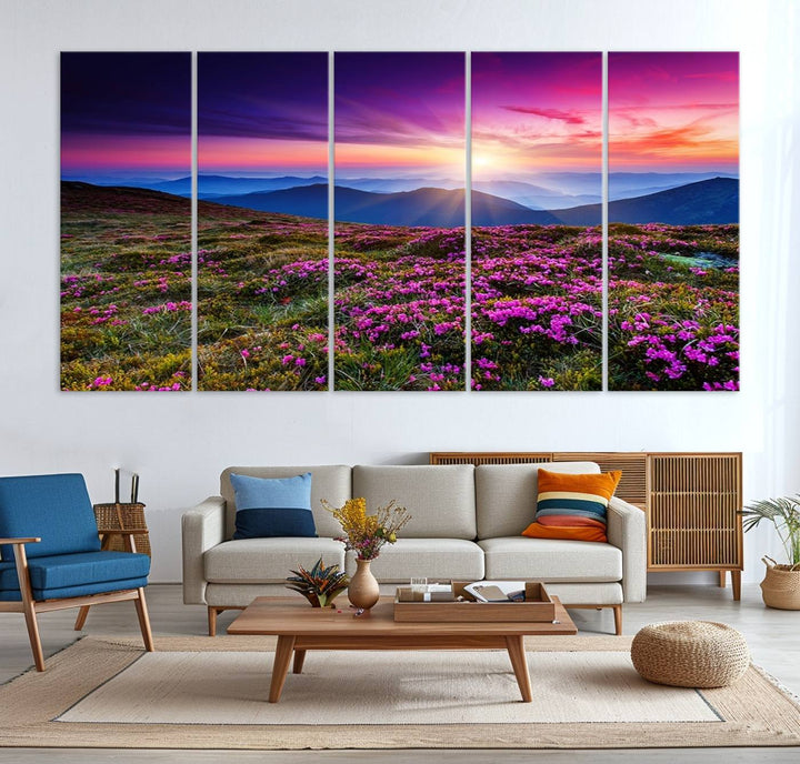 A 3-panel landscape photography canvas of a sunset over mountain meadows with purple wildflowers decorates the wall.