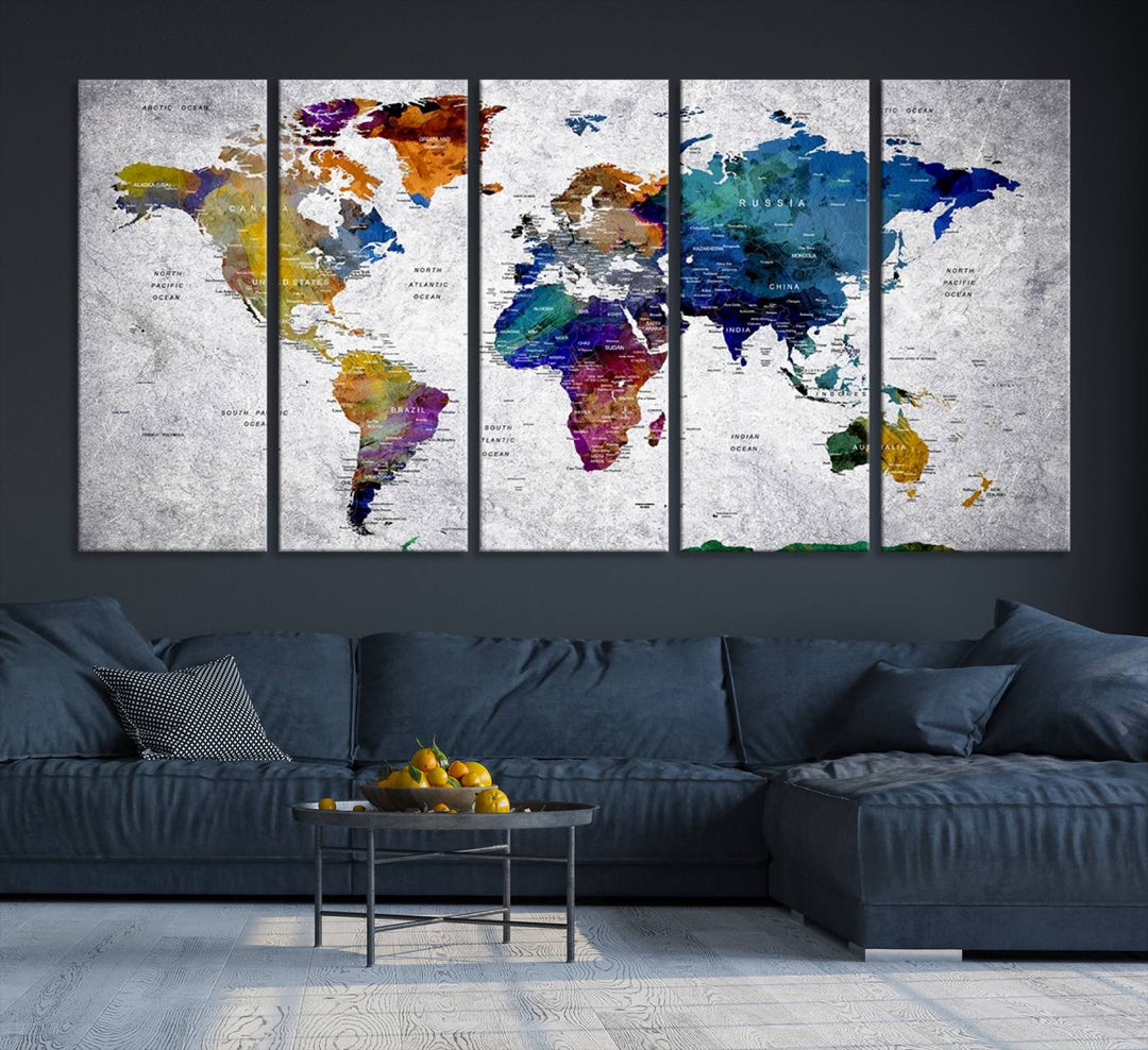 The World Map Art Canvas Print, featuring country names on a grunge-stained gray background, is perfect for stylish home decor.