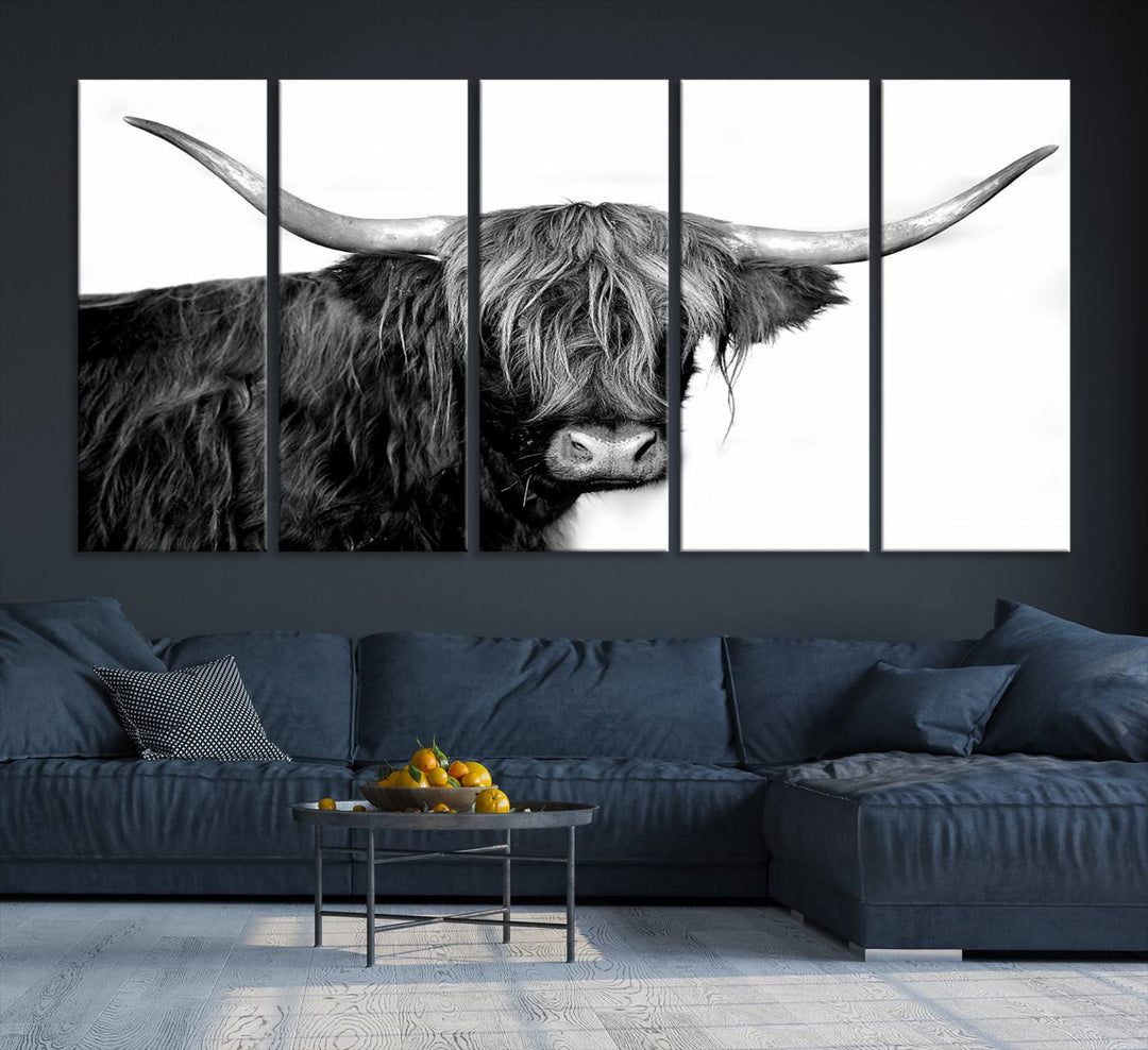 The Black and White Highland Cow Multi Panel Wall Art Canvas Print with UV-protection hangs prominently.