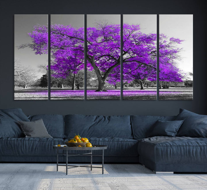 The Big Purple Tree Wall Art Canvas Print showcases a vibrant purple tree set against a black-and-white landscape.