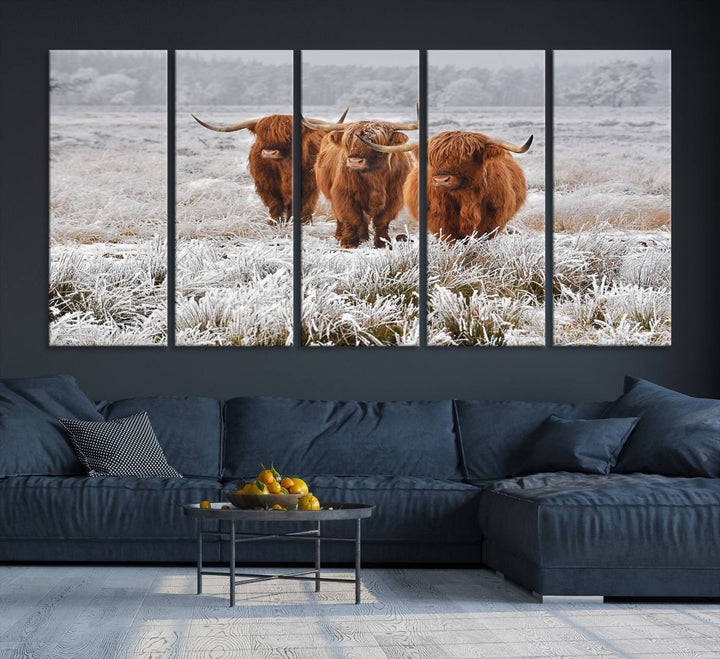 The Highland Cows in Snow canvas showcases three cattle in a frosty field.