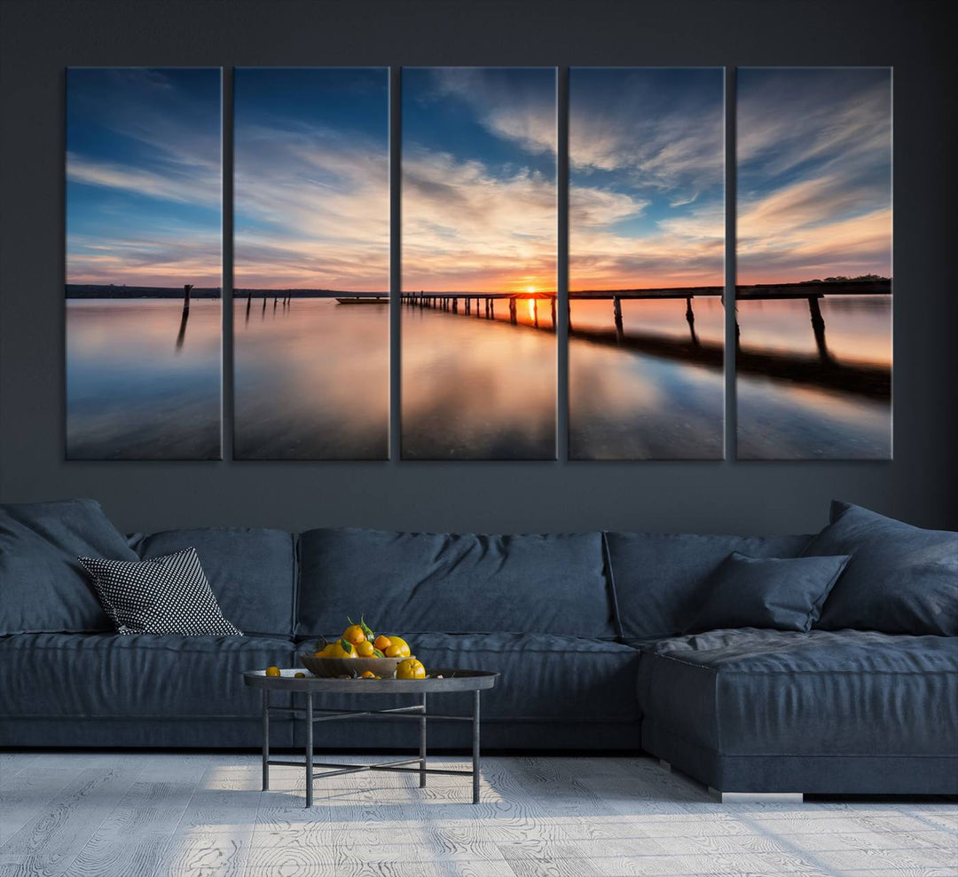 The Sunset Pier Canvas features a serene coastal landscape with vibrant hues under cloudy skies, ideal for modern decor.