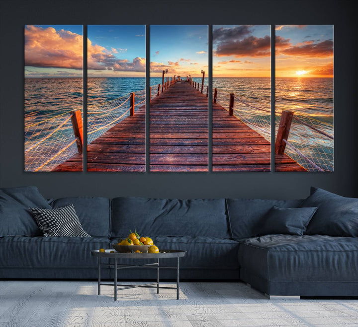 The Sunset Pier Canvas Wall Art is a triptych featuring an ocean landscape that elegantly captures a tranquil beach sunset with gentle ocean waves. It comes beautifully framed and ready to hang.