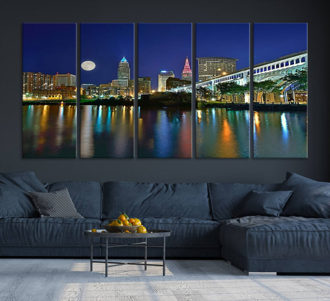 Cleveland City Lights Night Skyline Wall Art canvas showcases a moonlit cityscape reflected on water.