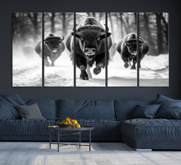 The Buffalo Wall Art Canvas Print of bison running through snow adorns the wall.