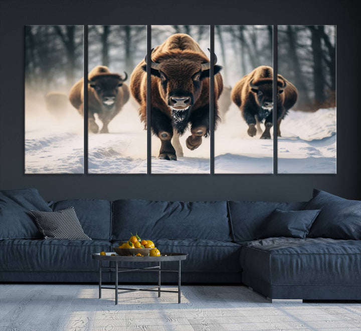 Wall art titled Cow Bighorn shows three bison running through snow in a forest.