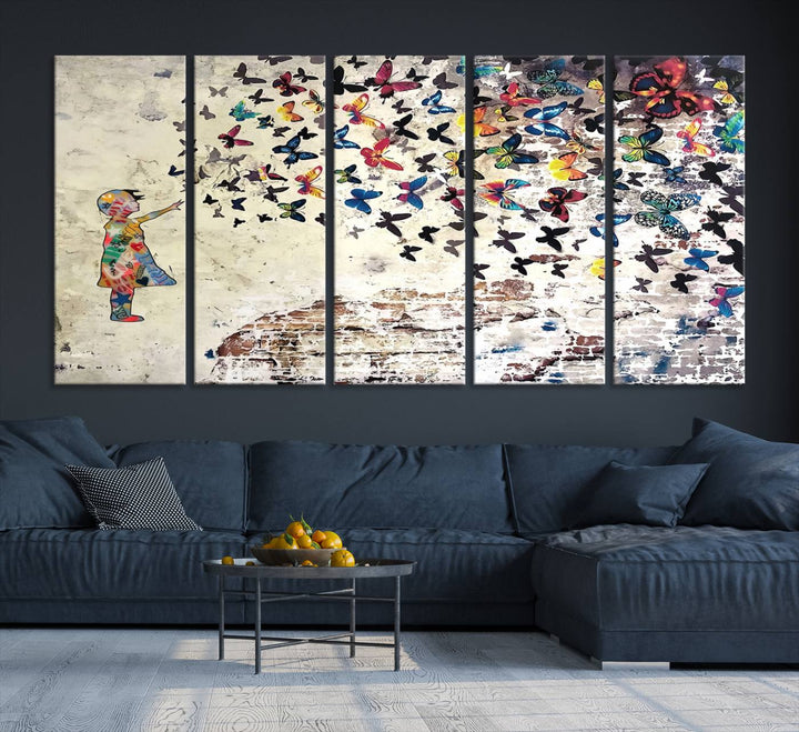 A Banksy Girl Butterfly Canvas Print is displayed on the textured wall.