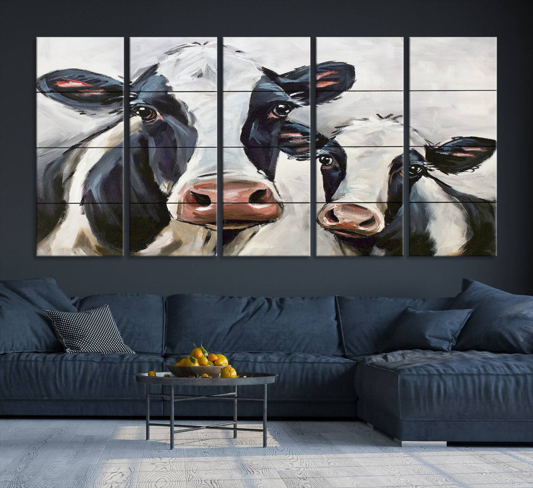 The Vintage Baby and Mom Cattle Canvas, featuring cows with black and white patches, is a prominent piece of wall art.