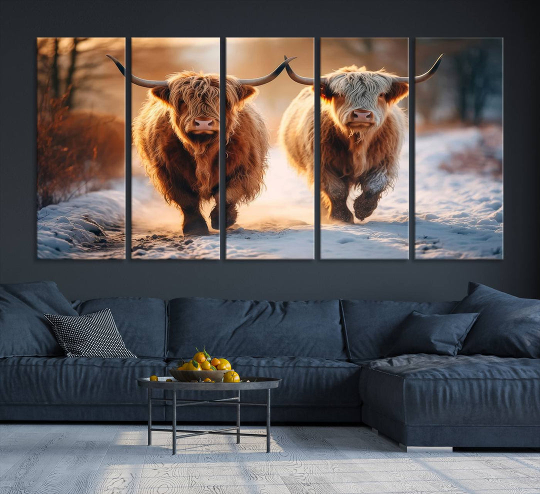 The wall art is a Scottish Highland Cow Horn canvas print featuring cows on a snowy path bathed in warm sunlight, serving as a rustic decor piece.