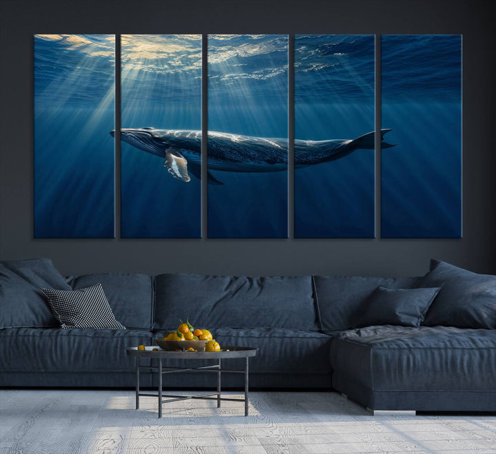 The Whale under Ocean wall art canvas print graces the white wall.