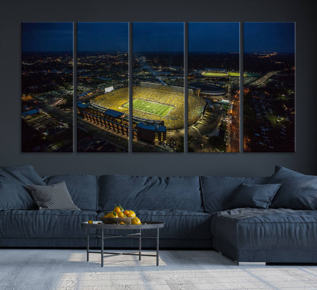 Aerial view of Michigan Stadium at night, surrounded by city lights, depicted on a Michigan Wolverines wall art canvas print.