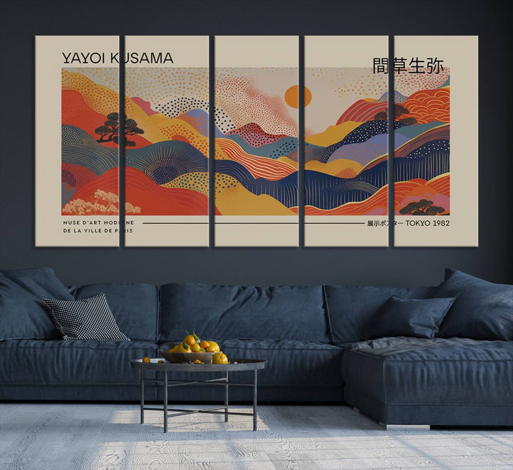 The Yayoi Kusama vibrant landscape canvas print featuring abstract mountains and a sun enhances the space with its modern aesthetic.