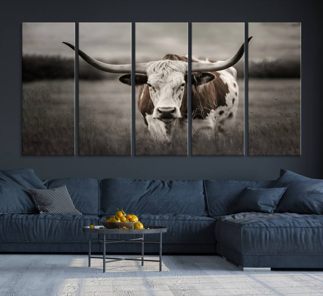 The Texas Longhorn Cow Canvas Wall Art Print adds a rustic touch to a living room.