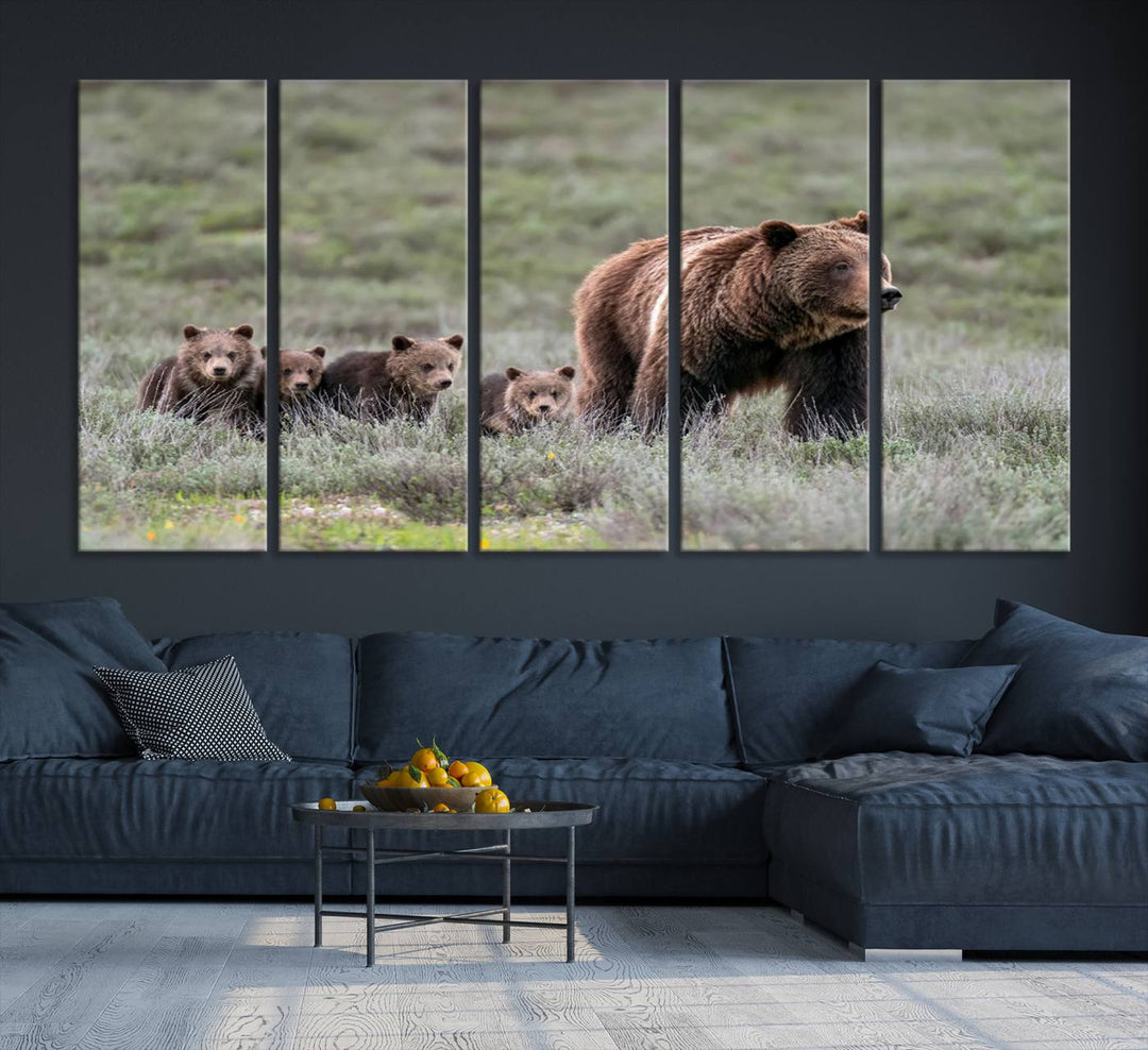 The large canvas print titled "Queen of the Tetons, 399 Grizzly Bear Cubs" showcases majestic wildlife photography of a bear and her cubs walking through the grass. This stunning canvas wall art, handmade in the USA, adds a charming touch to any room with its rustic decor appeal.