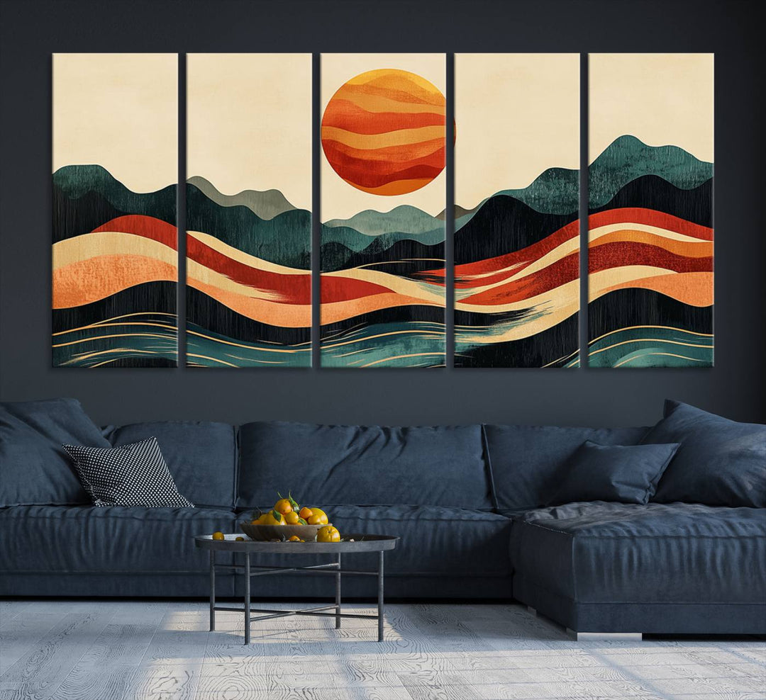 The Mountain Triptych wall art, featuring a design of the sun, mountains, and waves, is displayed prominently on the wall.