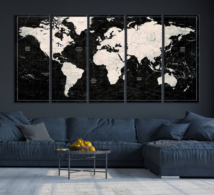 A bold global style framed black and white world map canvas print, presented in three panels, perfect for modern home or office decor.