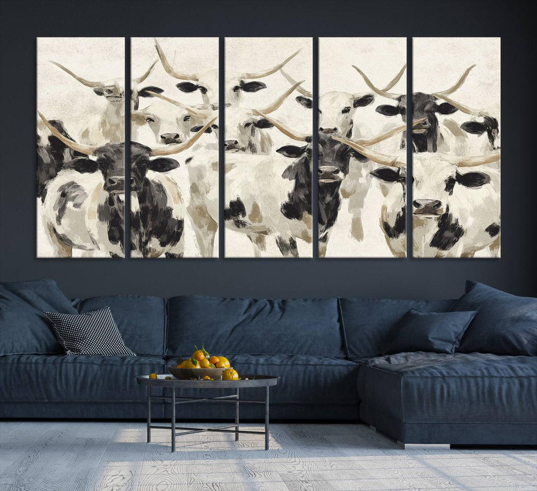 Canvas print titled Longhorn Texas Cow Drawing, depicting longhorn cattle with black and white markings, made in the USA, displayed on the wall.