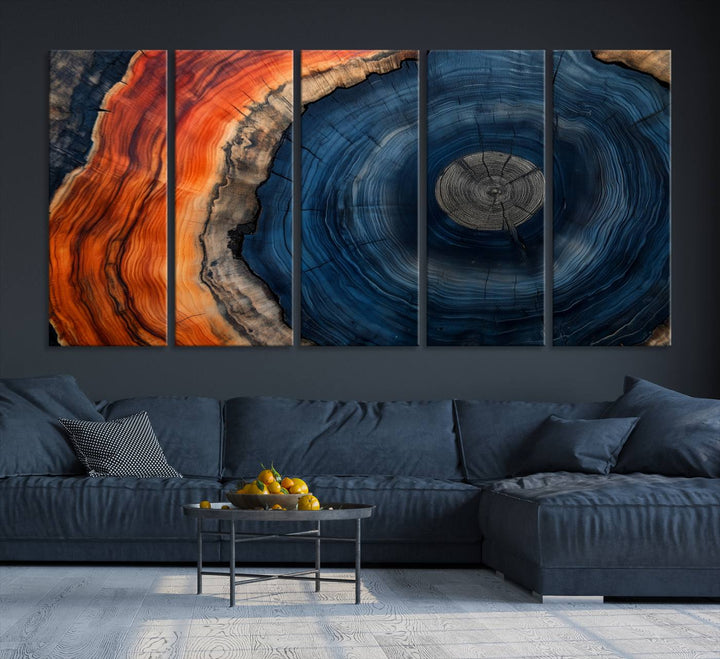 Abstract Tree Ring Wall Art Print on canvas featuring vibrant blue, orange, and brown rings with a natural rustic wood texture. Free shipping available!.