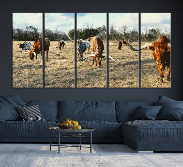 A herd of Texas Longhorn cattle grazing in an open field under a partly cloudy sky, capturing a rustic and Western ranch aesthetic.