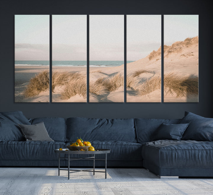 Soft pastel-toned beach scene with sand dunes, windswept grasses, and a calm ocean horizon, creating a serene coastal atmosphere.