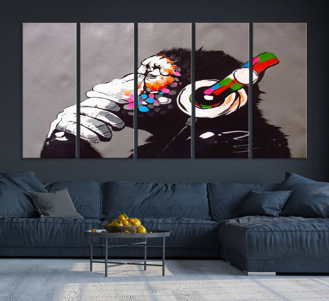 A vibrant triptych, the "DJ Monkey Listening to Music" wall art print, features a Banksy-inspired large canvas adorned with colorful modern pop art. This striking piece elegantly enhances the room with its dynamic and lively depiction.