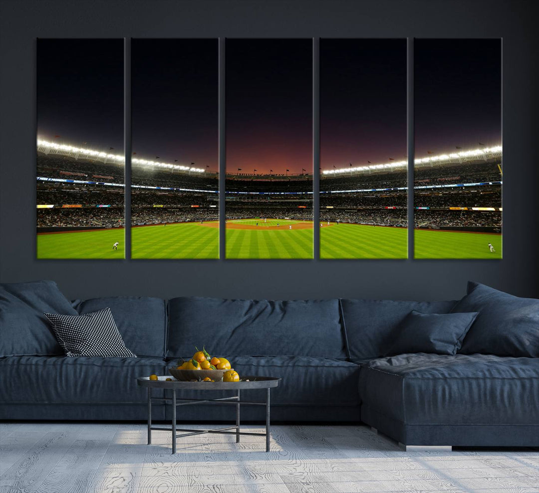 A night game at Yankee Stadium depicted on canvas beneath a sunset sky.